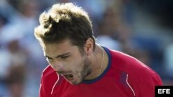 El tenista suizo Stanislas Wawrinka celebra al vencer al escocés Andy Murray.