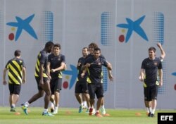 Los jugadores del FC Barcelona durante el entrenamiento que los azulgranas realizaron esta mañana de cara al partido de Liga de Campeones que disputarán mañana contra el Ajax de Amsterdam.